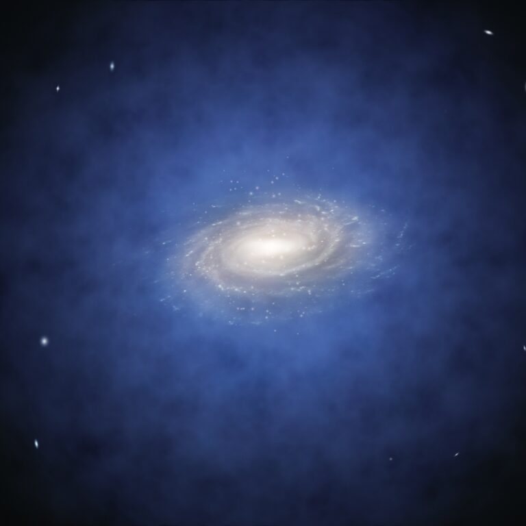 Grafik: Eine Galaxie, die sich mitten in einer blauen diffusen Wolke befindet.