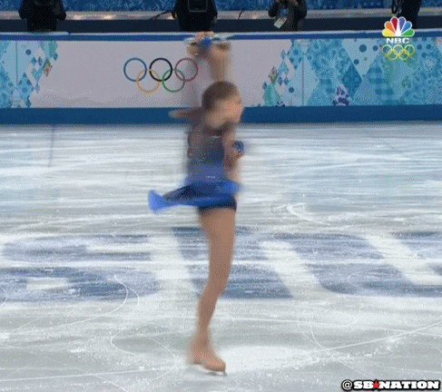 Eine Olympische Athletin dreht Pirouetten.