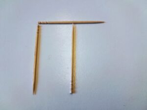 As previous image but the right hand toothpick has been moved across to the middle