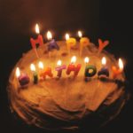 Birthday cake; candles read 'Happy Birthday'
