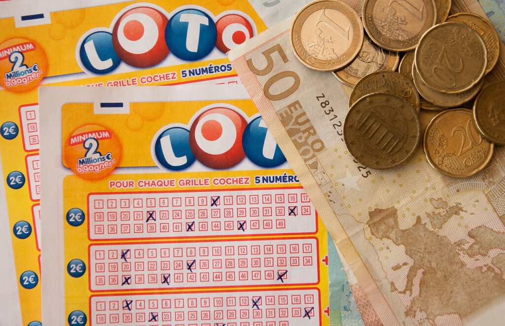 Photo of a Lotto ticket with some cash Euros arranged over it. Image by Jacqueline Macou from Pixabay.com 
